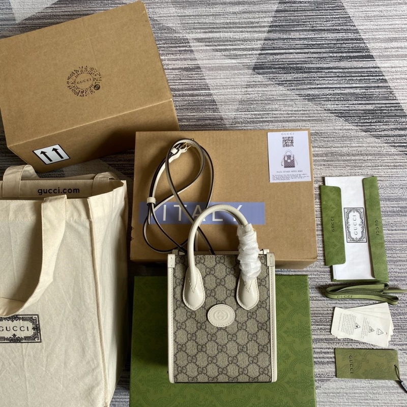 G*u*i top handle bags